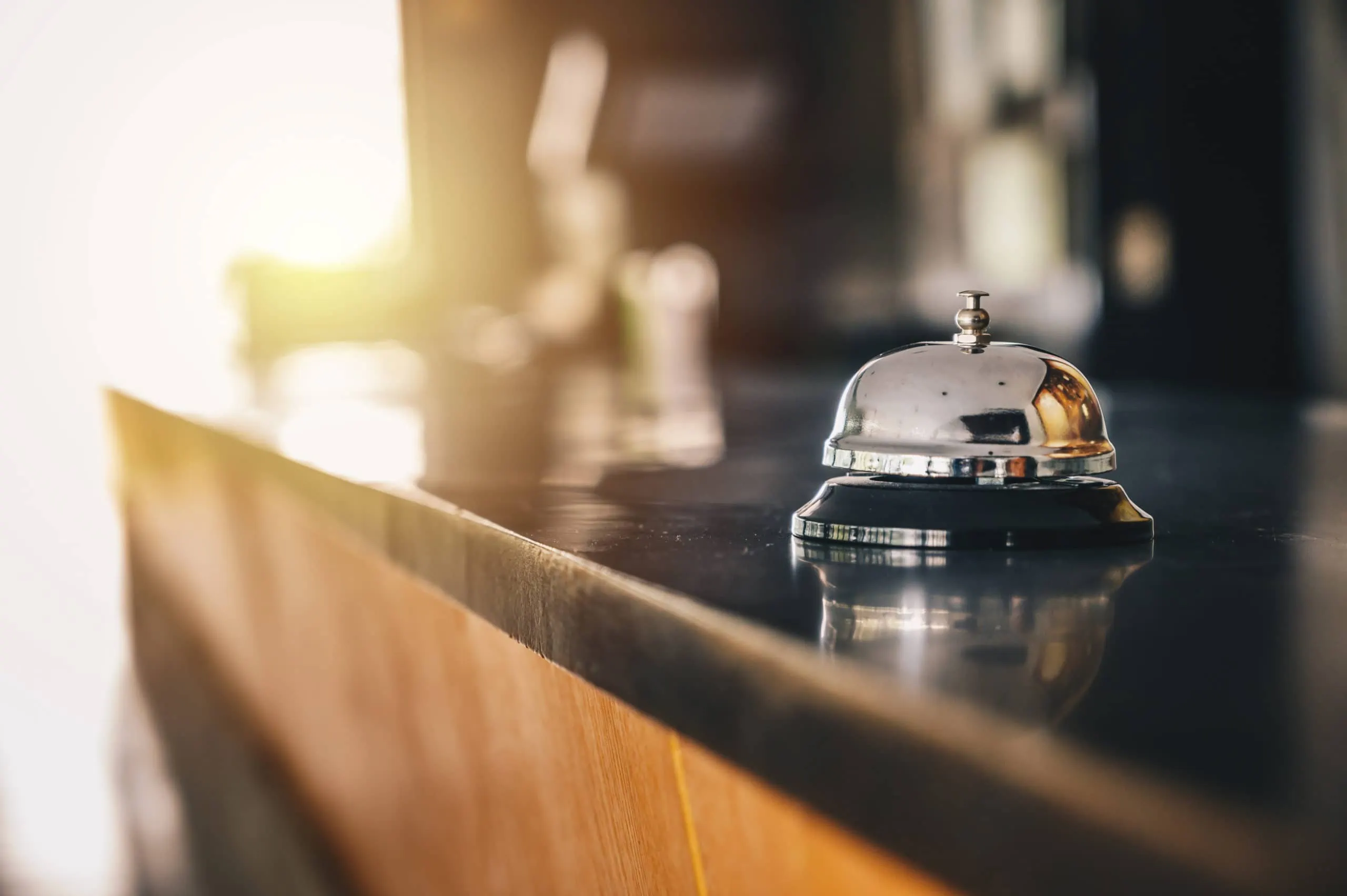 A,front,desk,bell,on,reception,counter.,hotel,bell,is