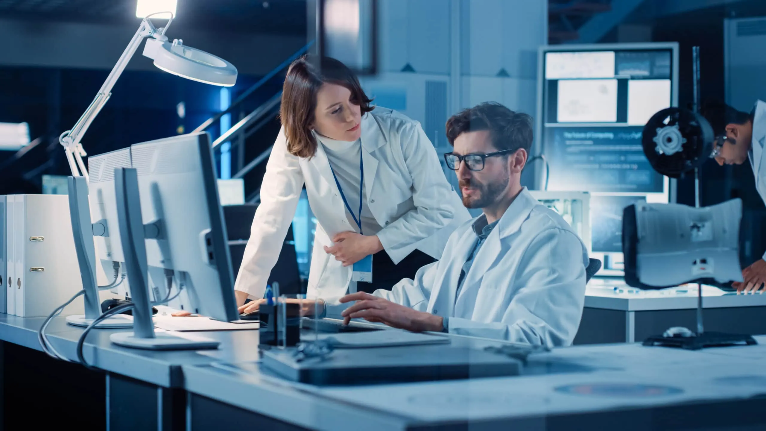 Machine,engine,development,engineer,working,on,computer,at,his,desk,