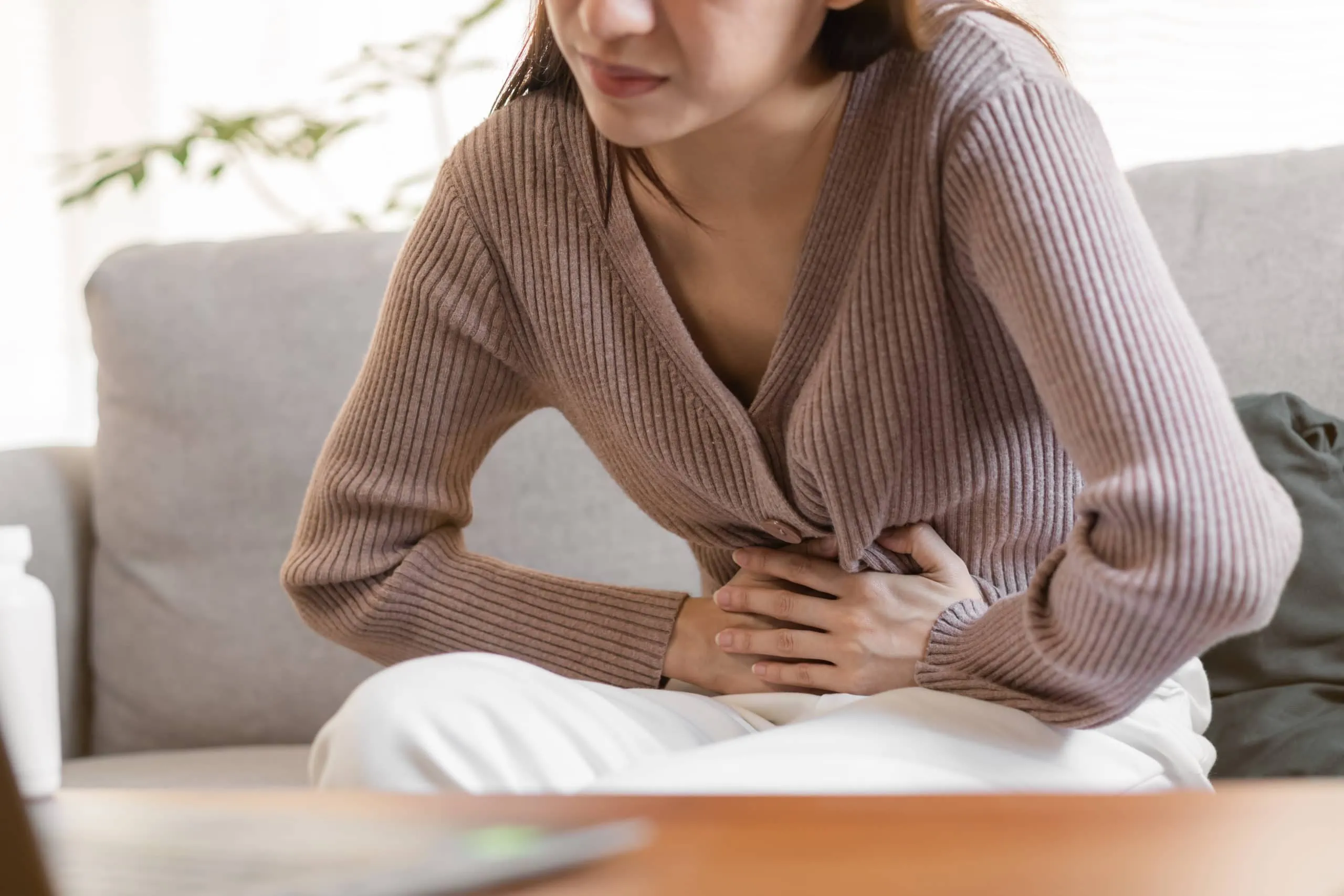 Flatulence,young,asian,woman,,girl,hand,in,stomach,ache,,suffer