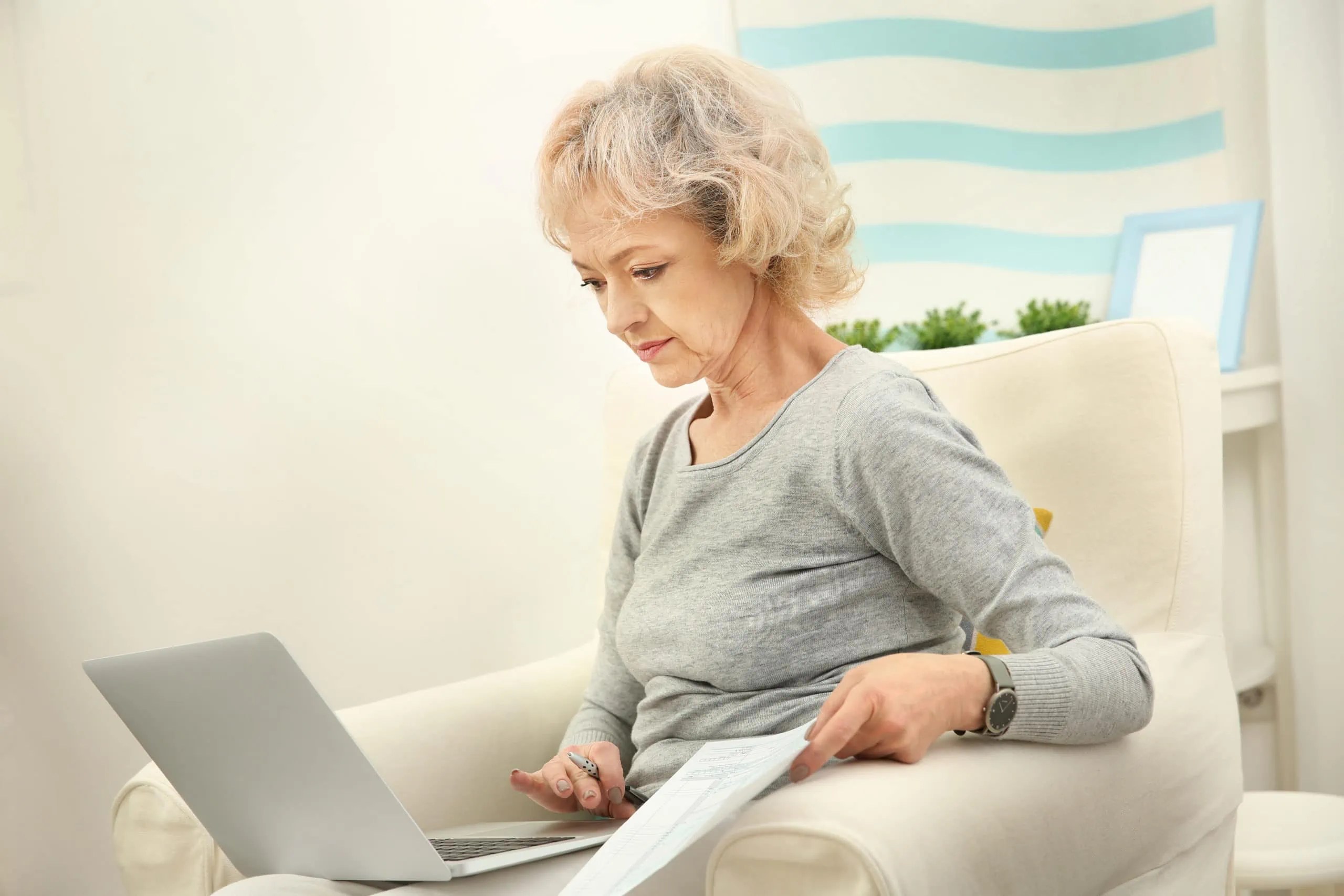 Senior,woman,calculating,taxes,at,home