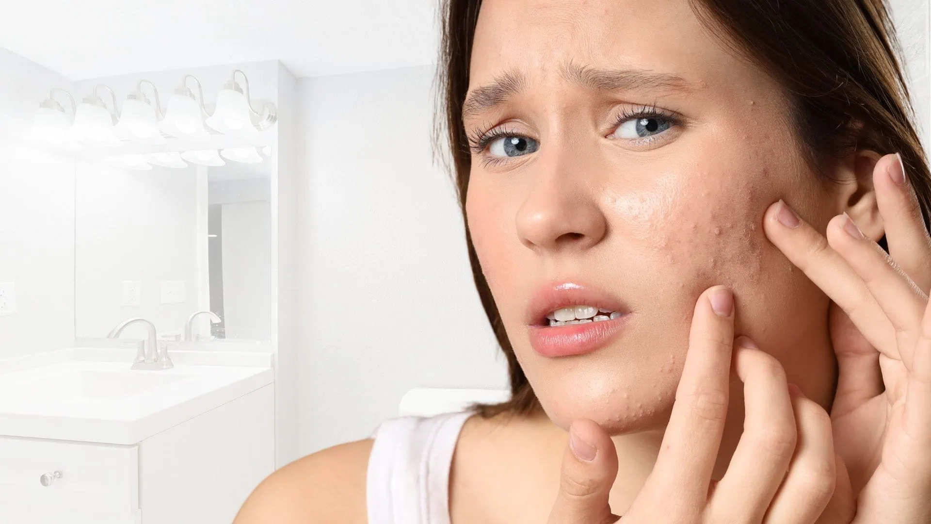 Young Woman Touching Acne Prone Skin Bathroom